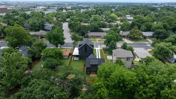 an aerial view of a house with outdoor space and street view