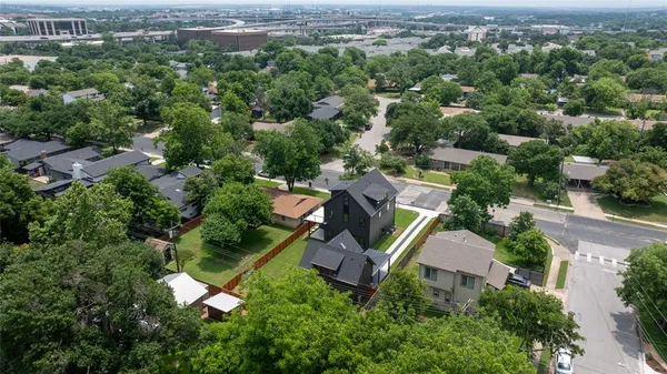 an aerial view of a house with a yard