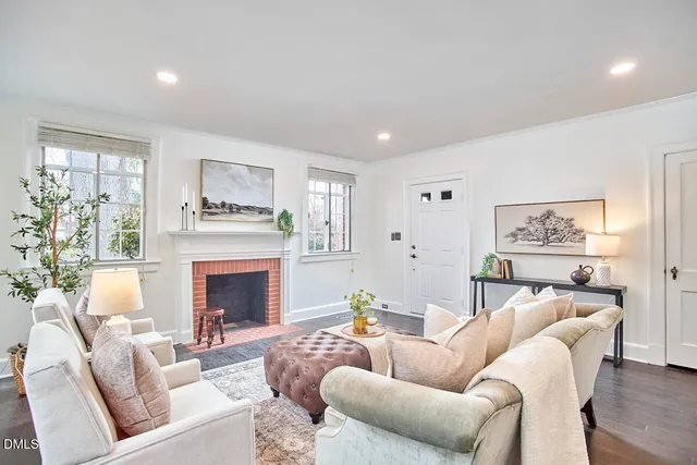 a living room with furniture and a fireplace