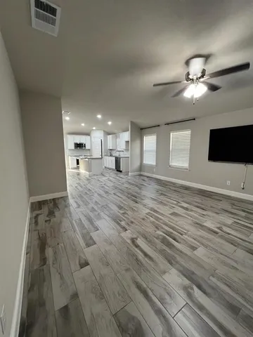 an empty room with an empty space and window