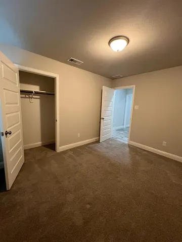a view of a livingroom with a ceiling fan