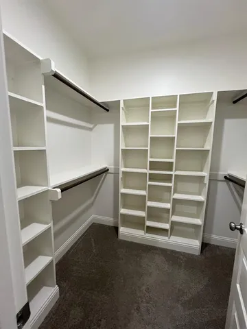a view of an empty walk in closet