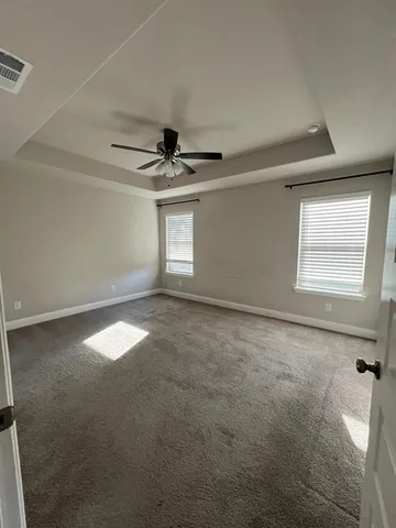 a view of empty room with windows