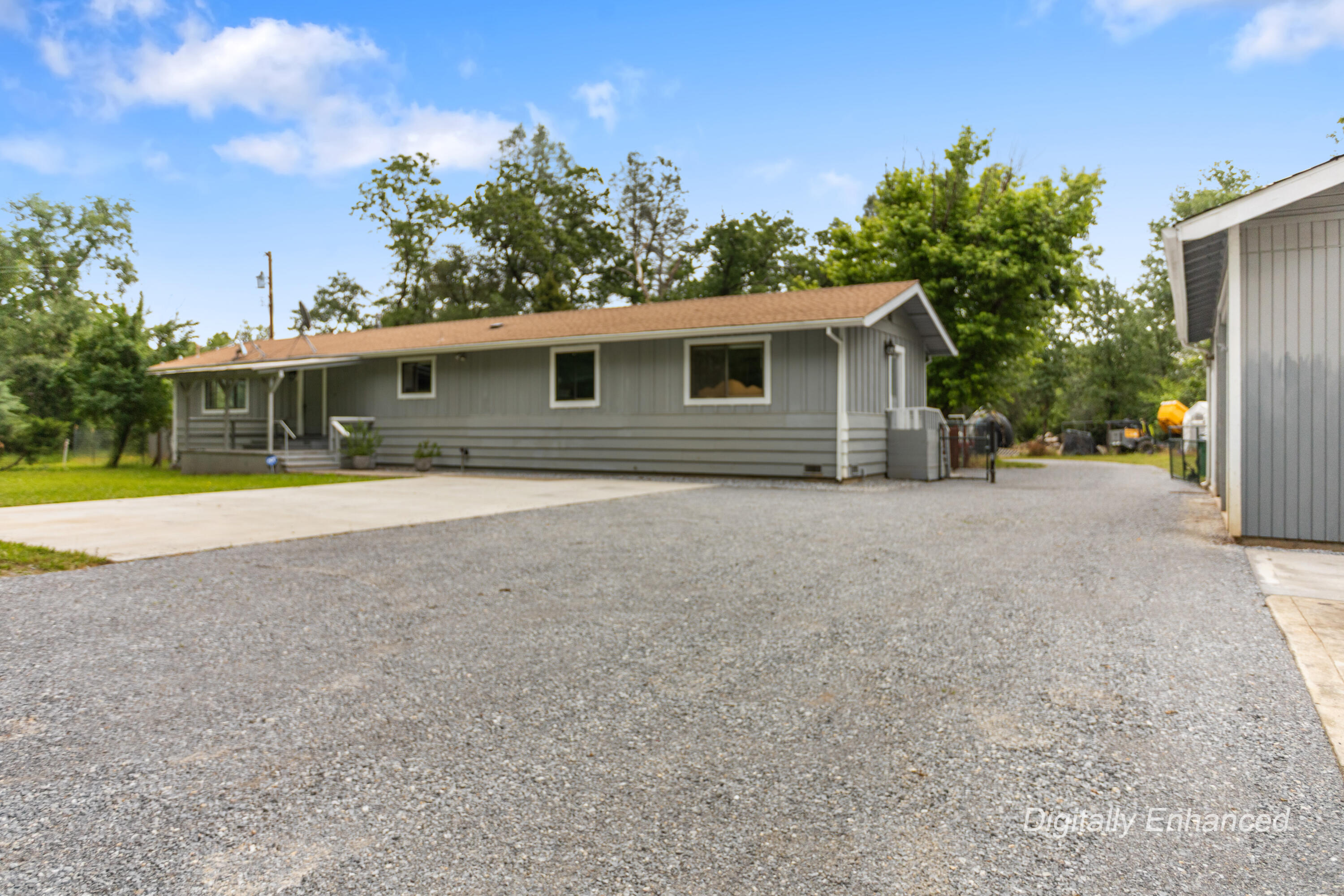 9891 Harley Leighton Road Redding, CA 96003 - Photo 11 of 52 a view of a house with a yard and potted plants