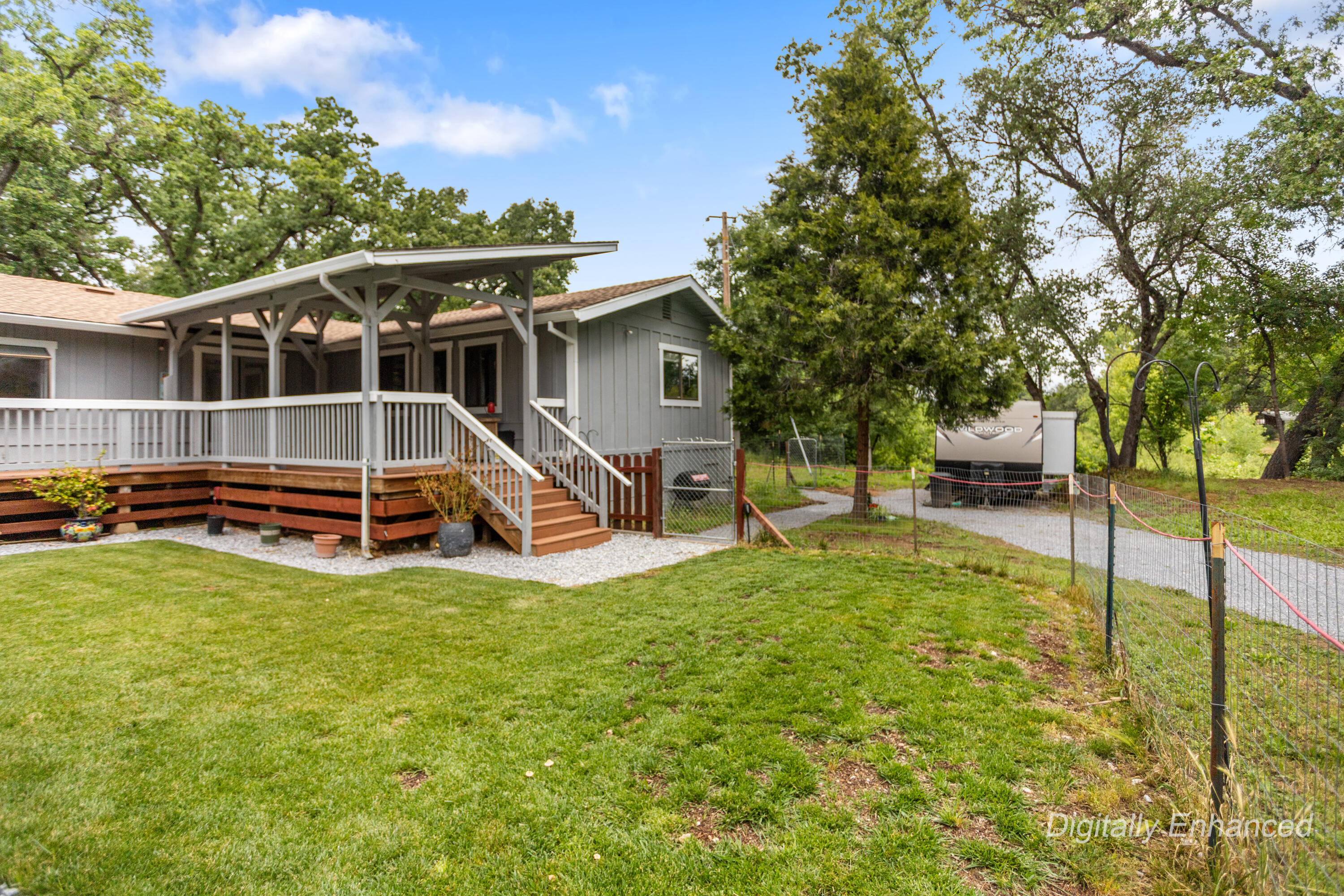 9891 Harley Leighton Road Redding, CA 96003 - Photo 14 of 52 a view of a house with backyard porch and sitting area