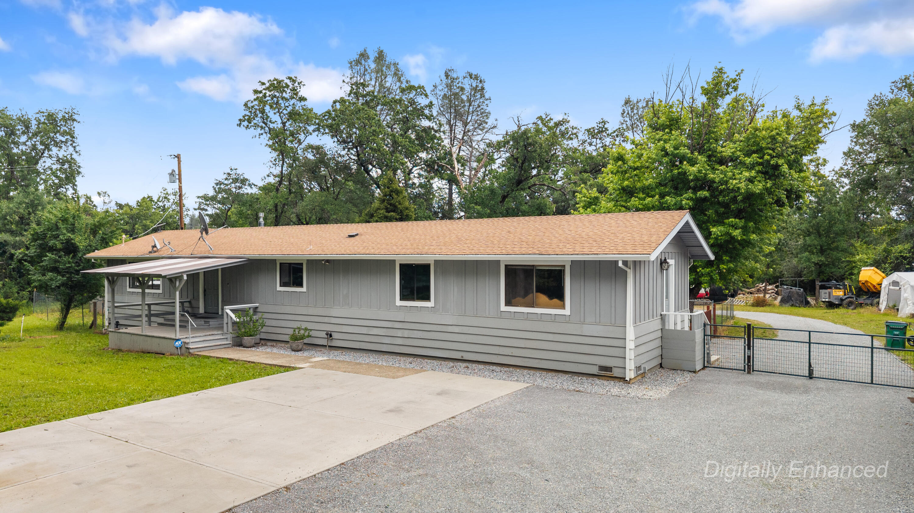9891 Harley Leighton Road Redding, CA 96003 - Photo 2 of 52 a front view of a house with swimming pool and porch