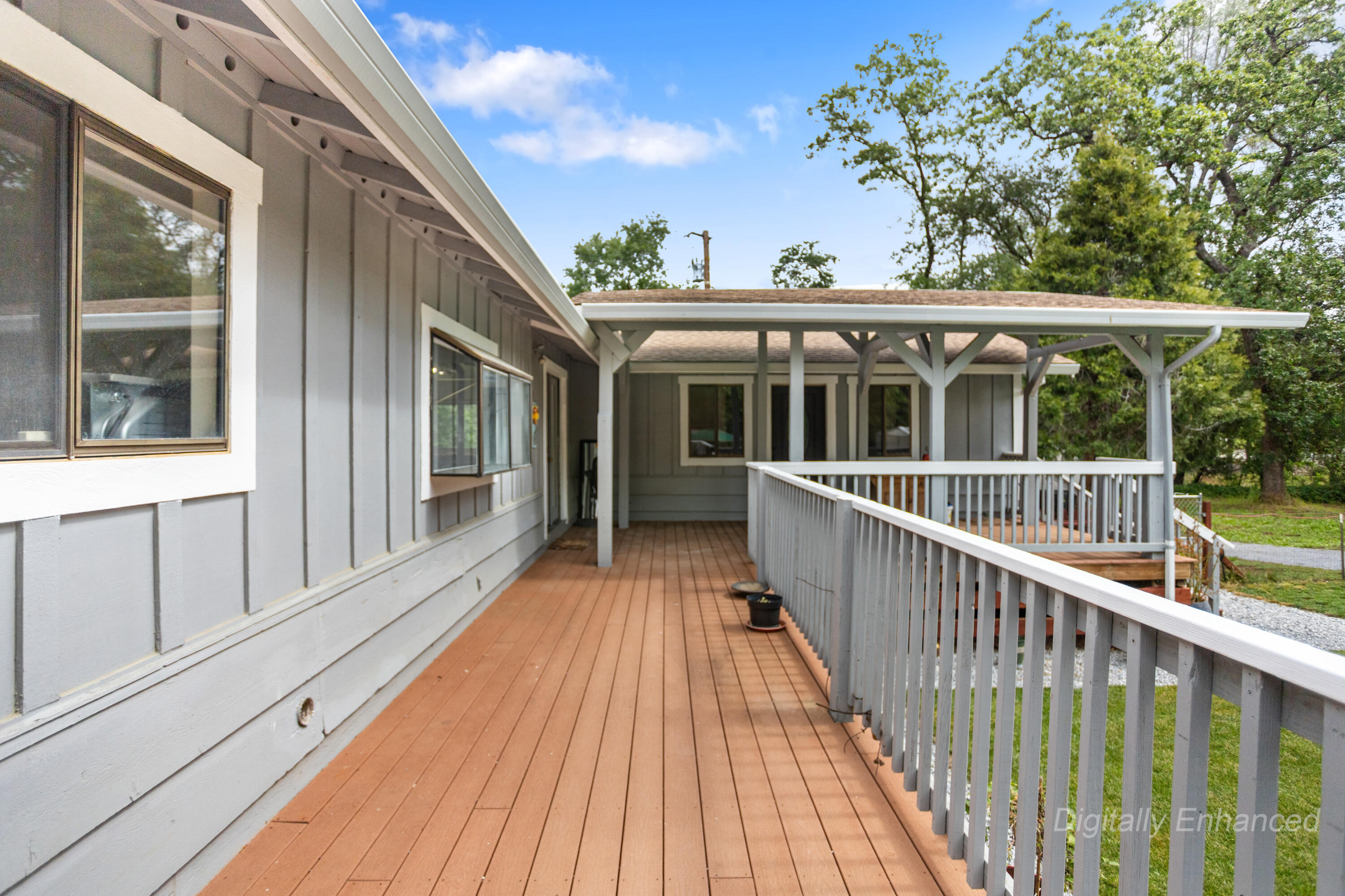 9891 Harley Leighton Road Redding, CA 96003 - Photo 23 of 52 a view of a house with a large window and wooden floor