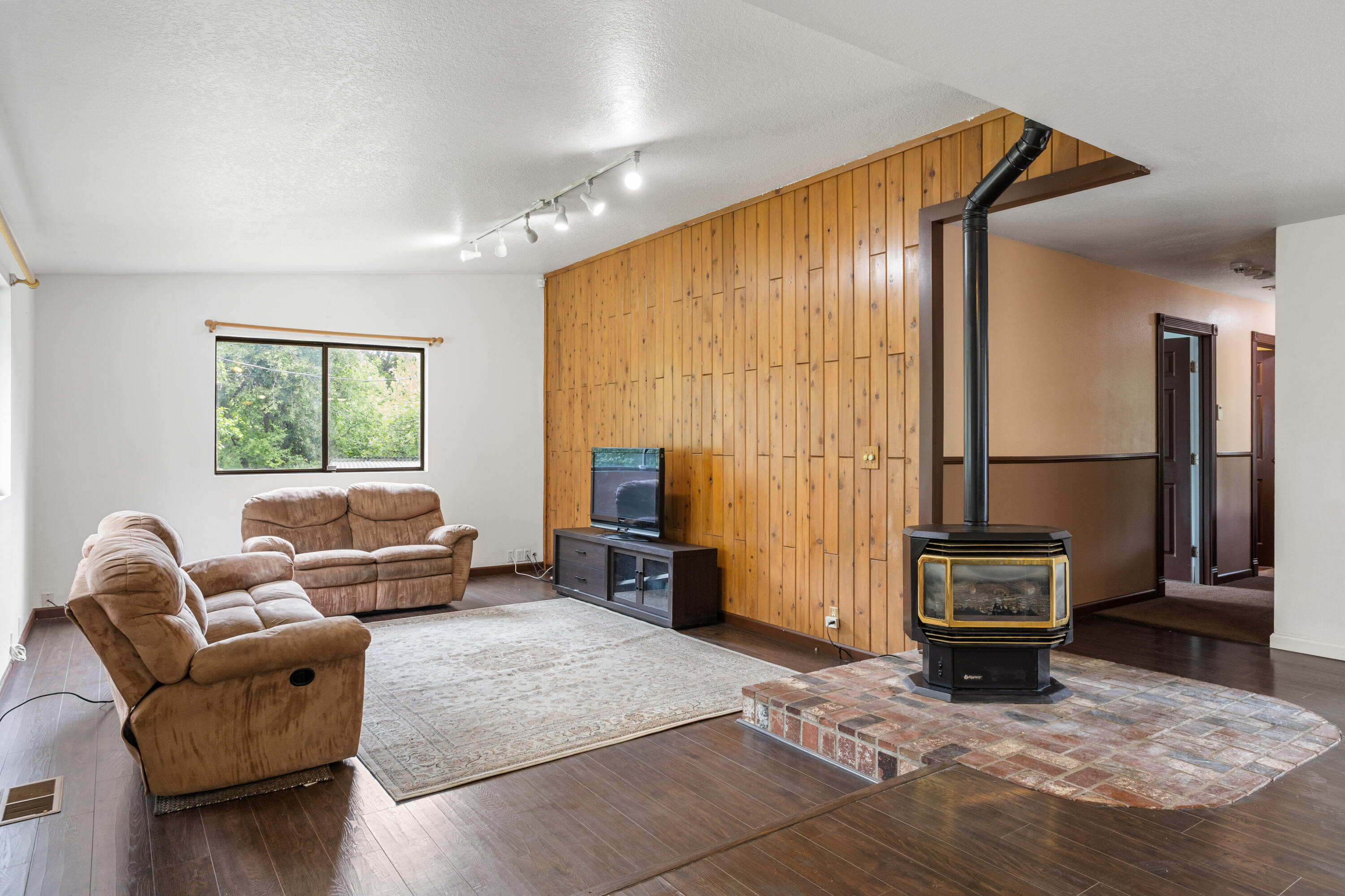 9891 Harley Leighton Road Redding, CA 96003 - Photo 27 of 52 a living room with furniture window and wooden floor