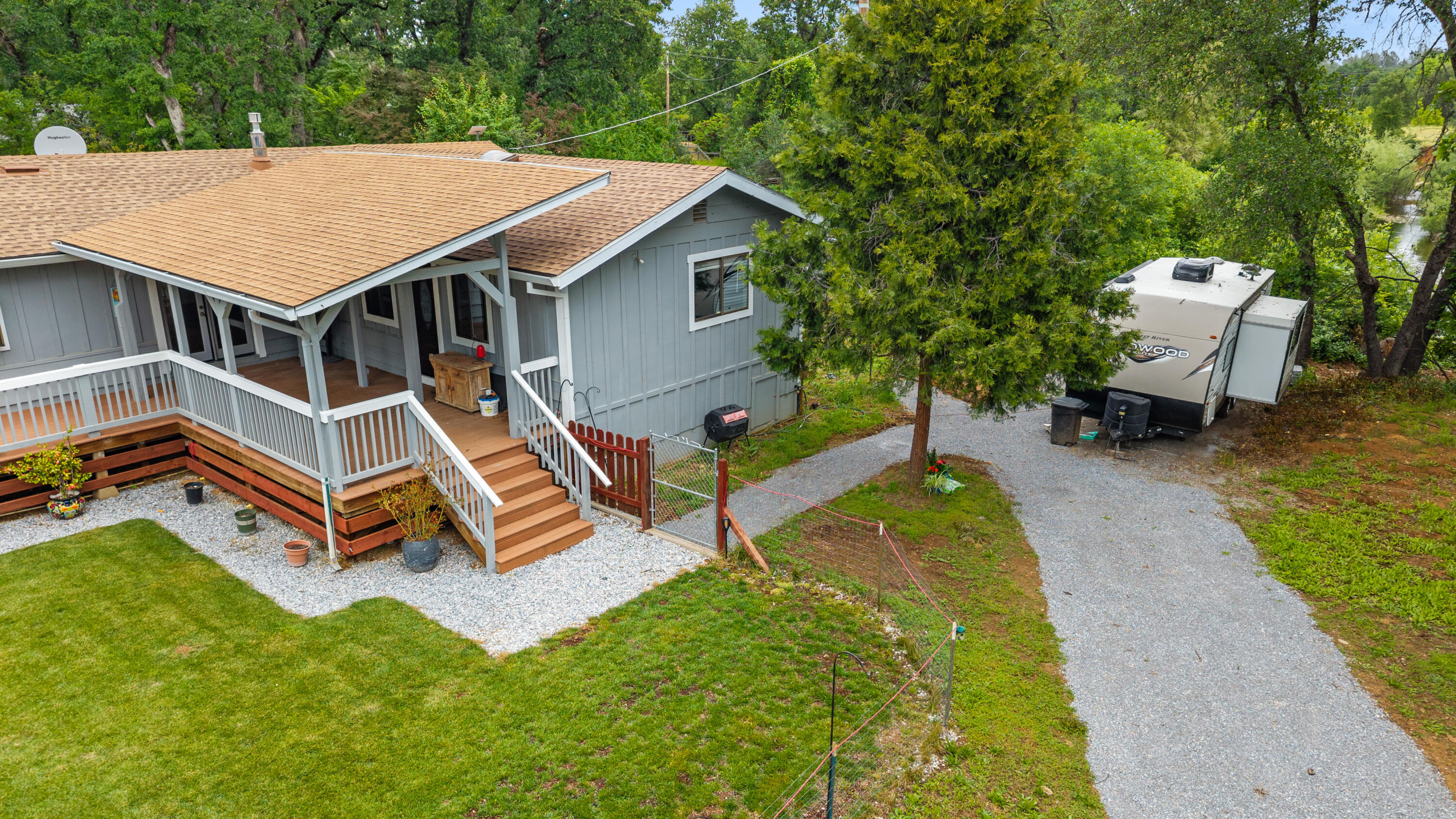 9891 Harley Leighton Road Redding, CA 96003 - Photo 6 of 52 an aerial view of a house with swimming pool and sitting area