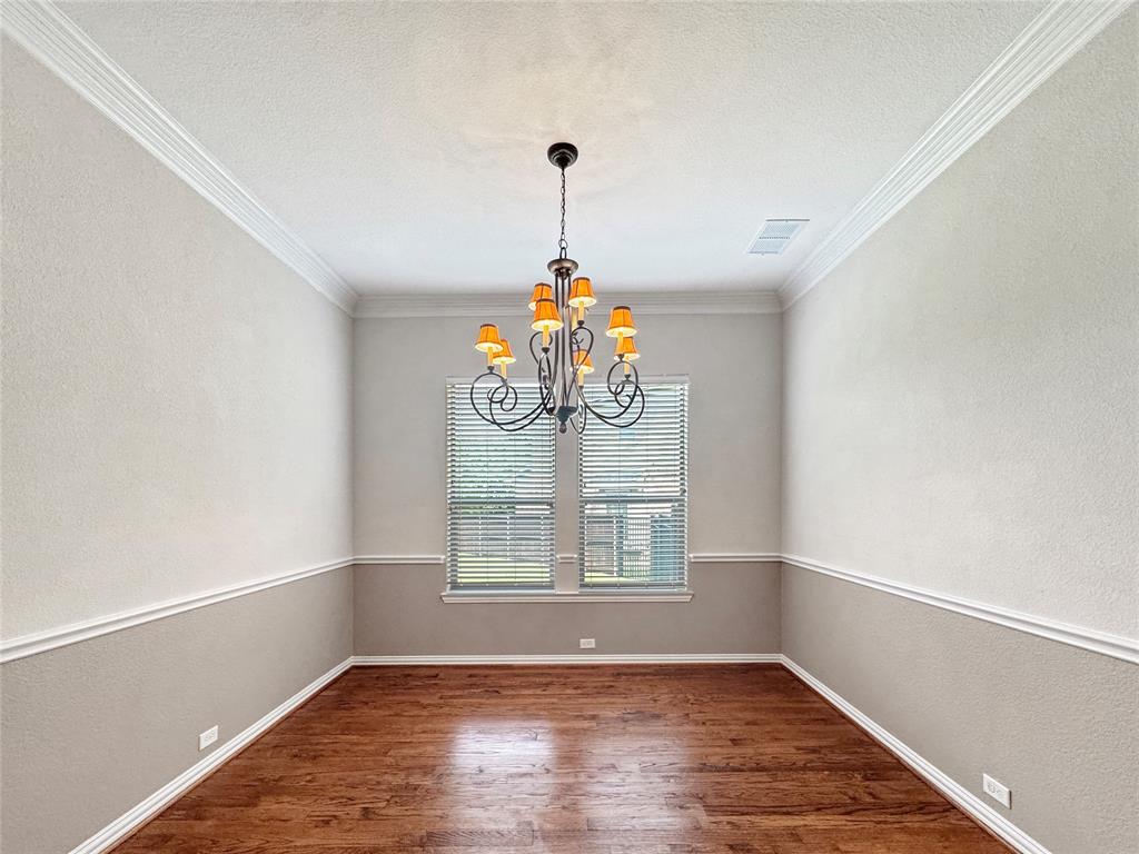 401 Varnum Way Fairview, TX 75069 - Photo 14 of 33 wooden floor in an empty room with a window