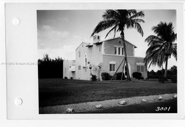 1333 Blue Road Coral Gables, FL 33146 - Photo 1 of 25 a view of a house with a yard