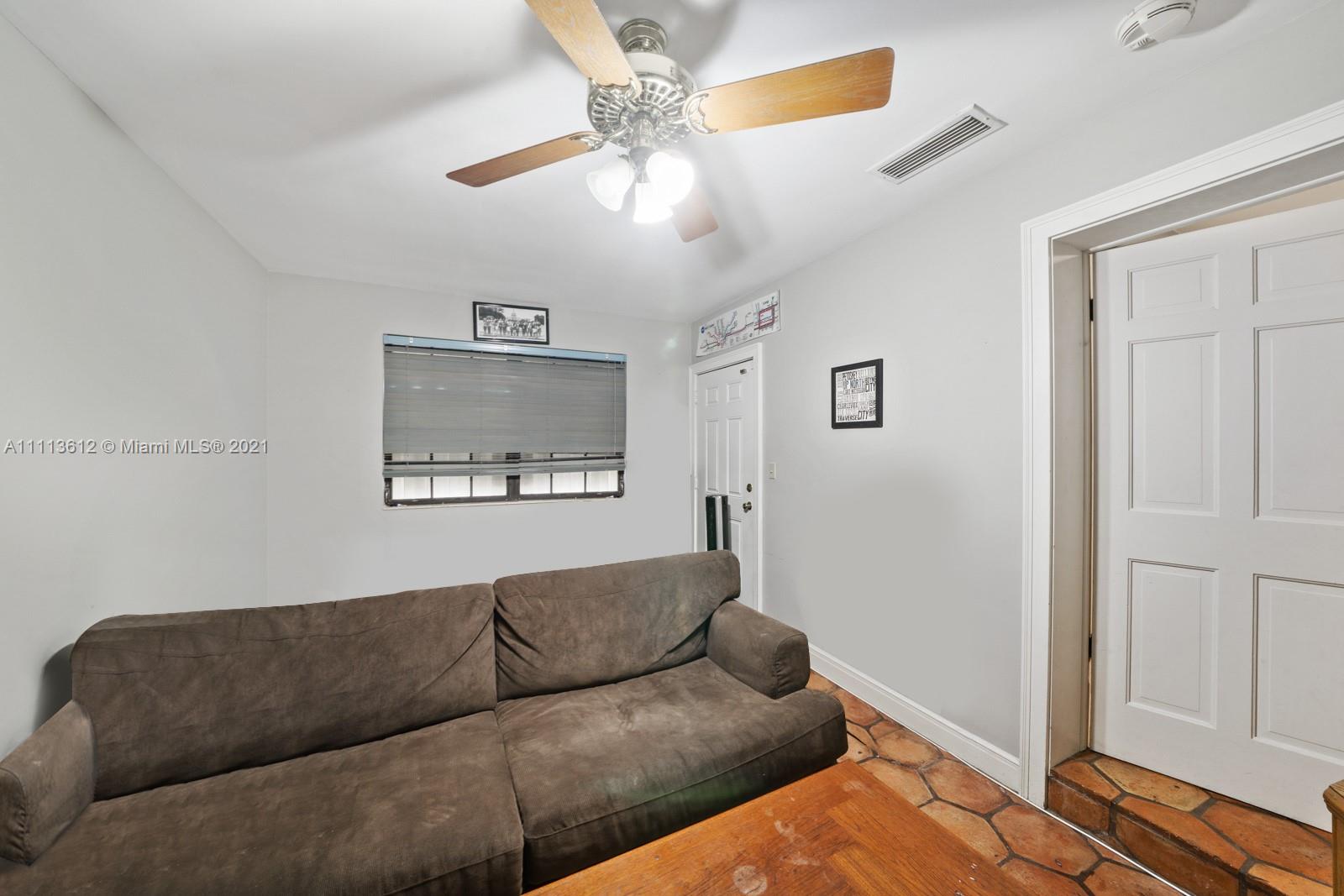 1333 Blue Road Coral Gables, FL 33146 - Photo 15 of 25 a living room with furniture and a window