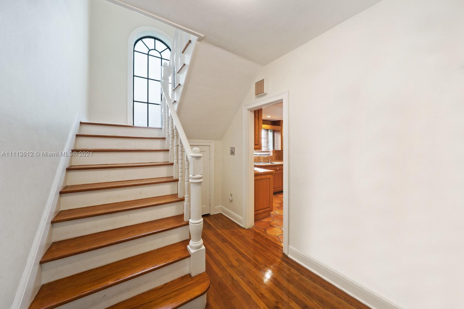 1333 Blue Road Coral Gables, FL 33146 - Photo 18 of 25 a view of entryway with wooden floor and windows