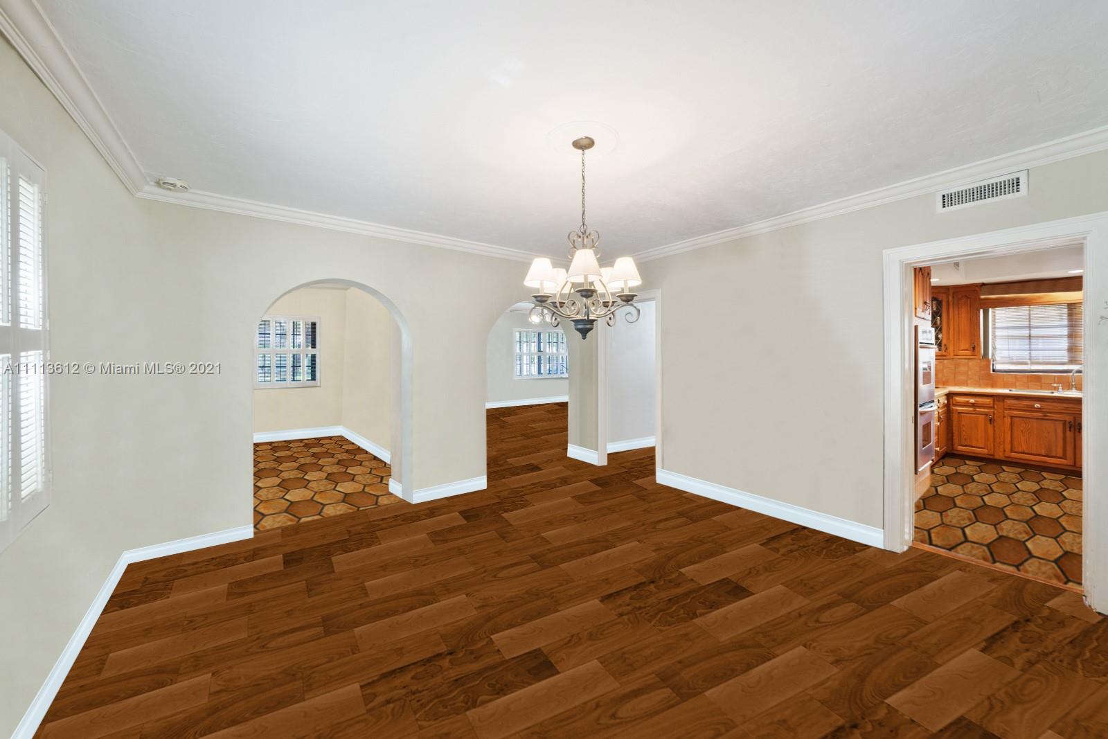 1333 Blue Road Coral Gables, FL 33146 - Photo 9 of 25 a bedroom with a bed chandelier and a window