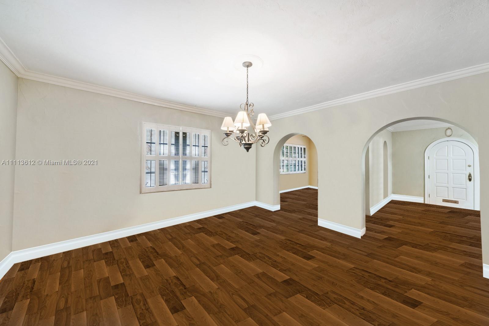 1333 Blue Road Coral Gables, FL 33146 - Photo 10 of 25 a view of empty room with window and wooden floor