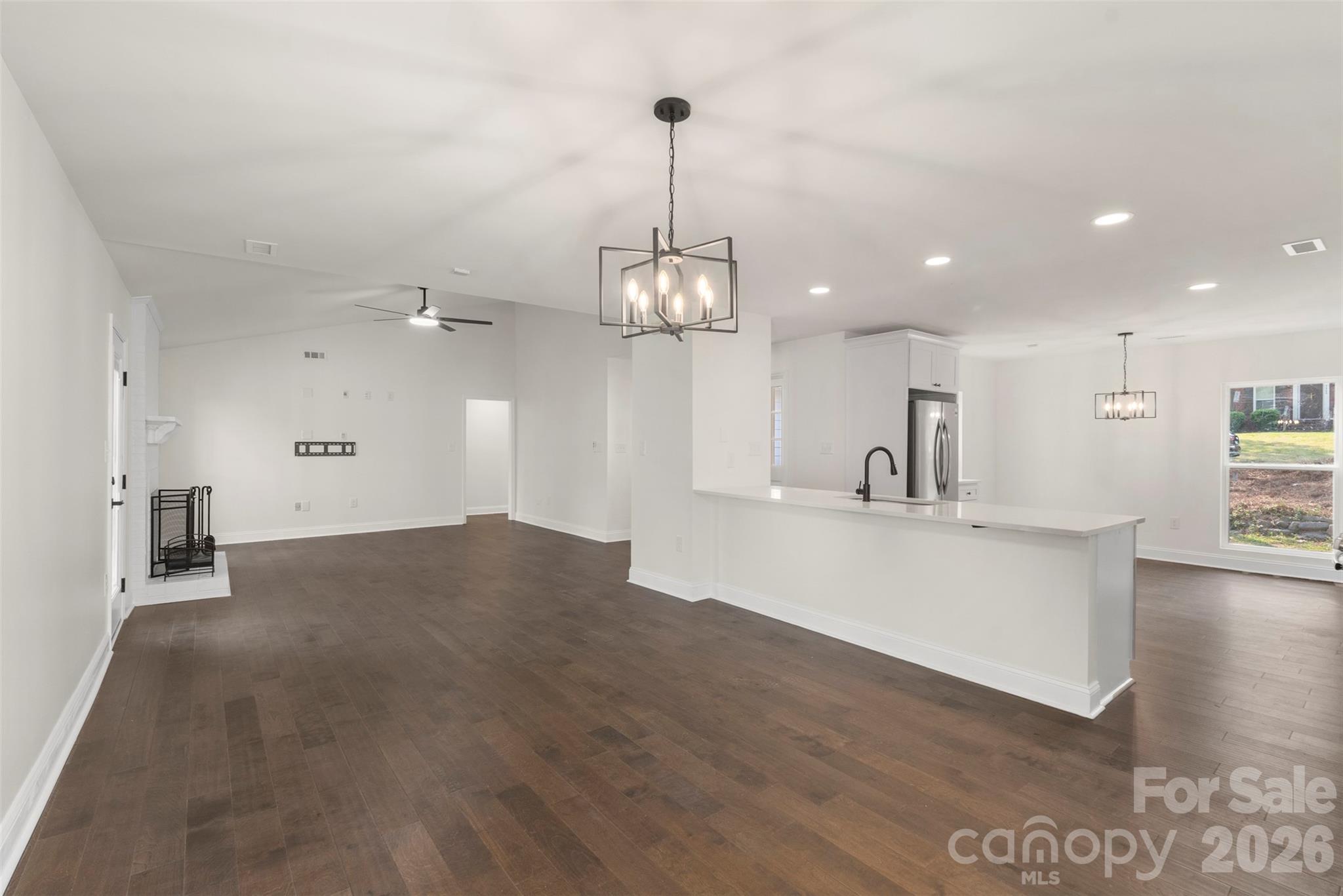 7308 Walterboro Road Charlotte, NC 28227 - Photo 14 of 43 a view of kitchen and hall with wooden floor
