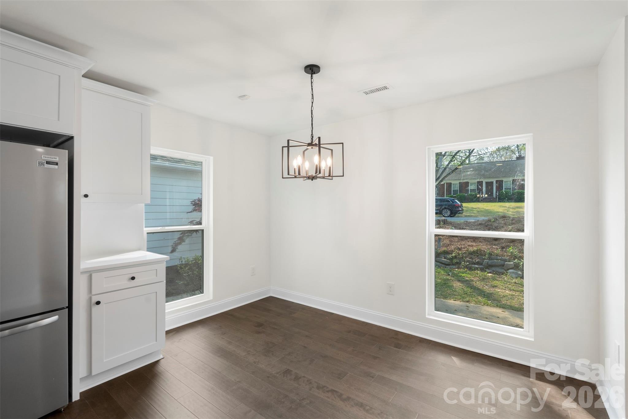 7308 Walterboro Road Charlotte, NC 28227 - Photo 19 of 43 a view of a room with wooden floor cabinet and windows