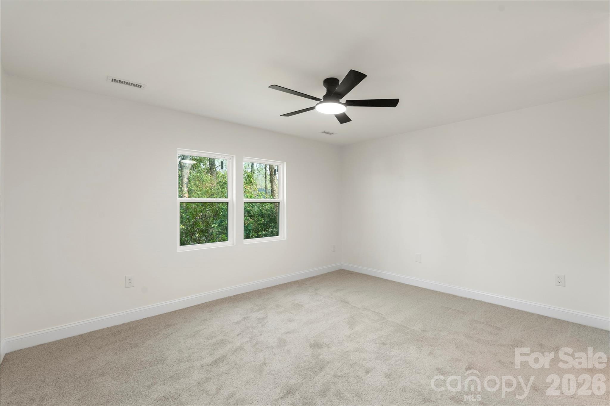 7308 Walterboro Road Charlotte, NC 28227 - Photo 22 of 43 a view of an empty room with a window