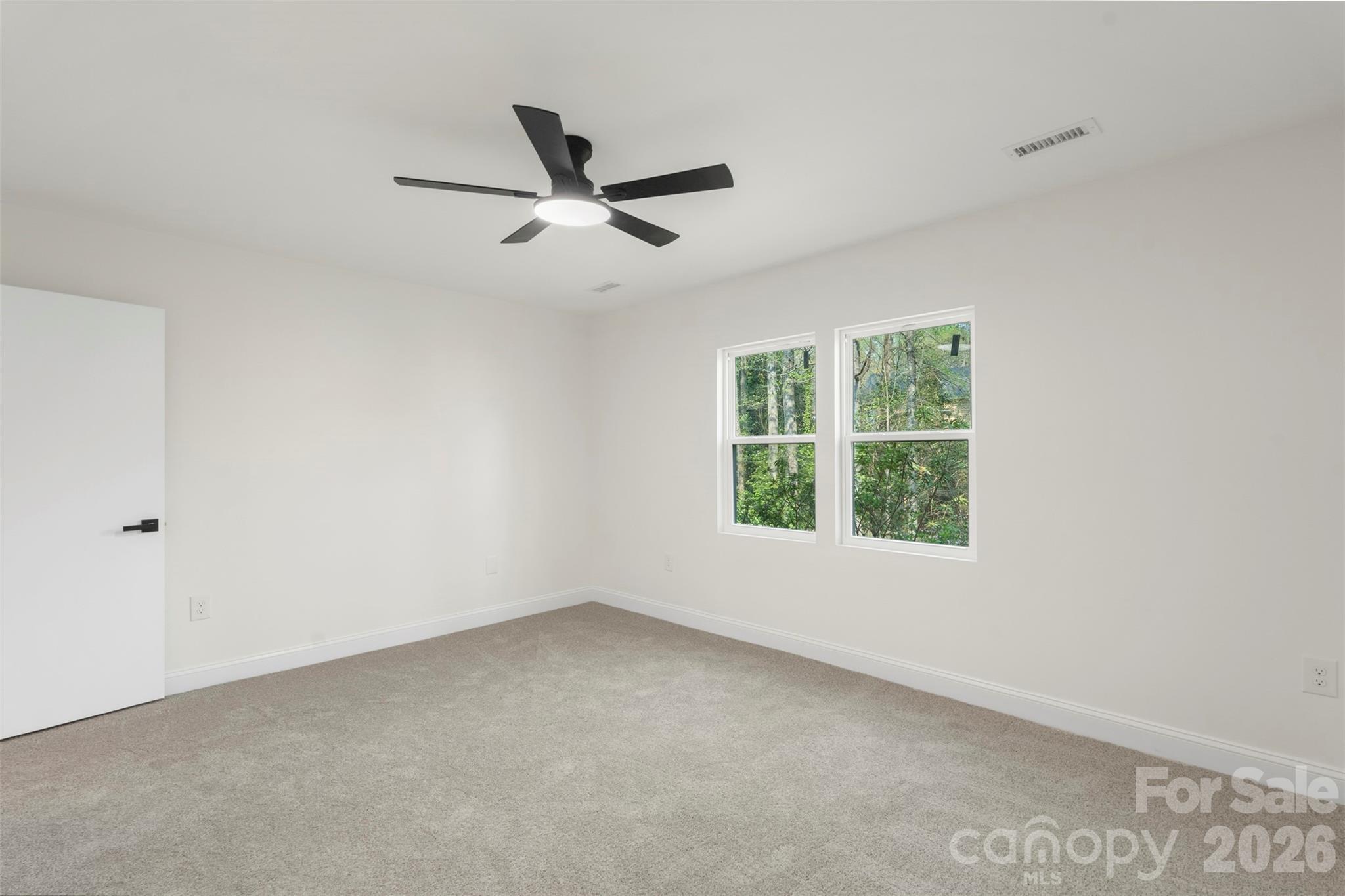 7308 Walterboro Road Charlotte, NC 28227 - Photo 23 of 43 a view of an empty room with a window