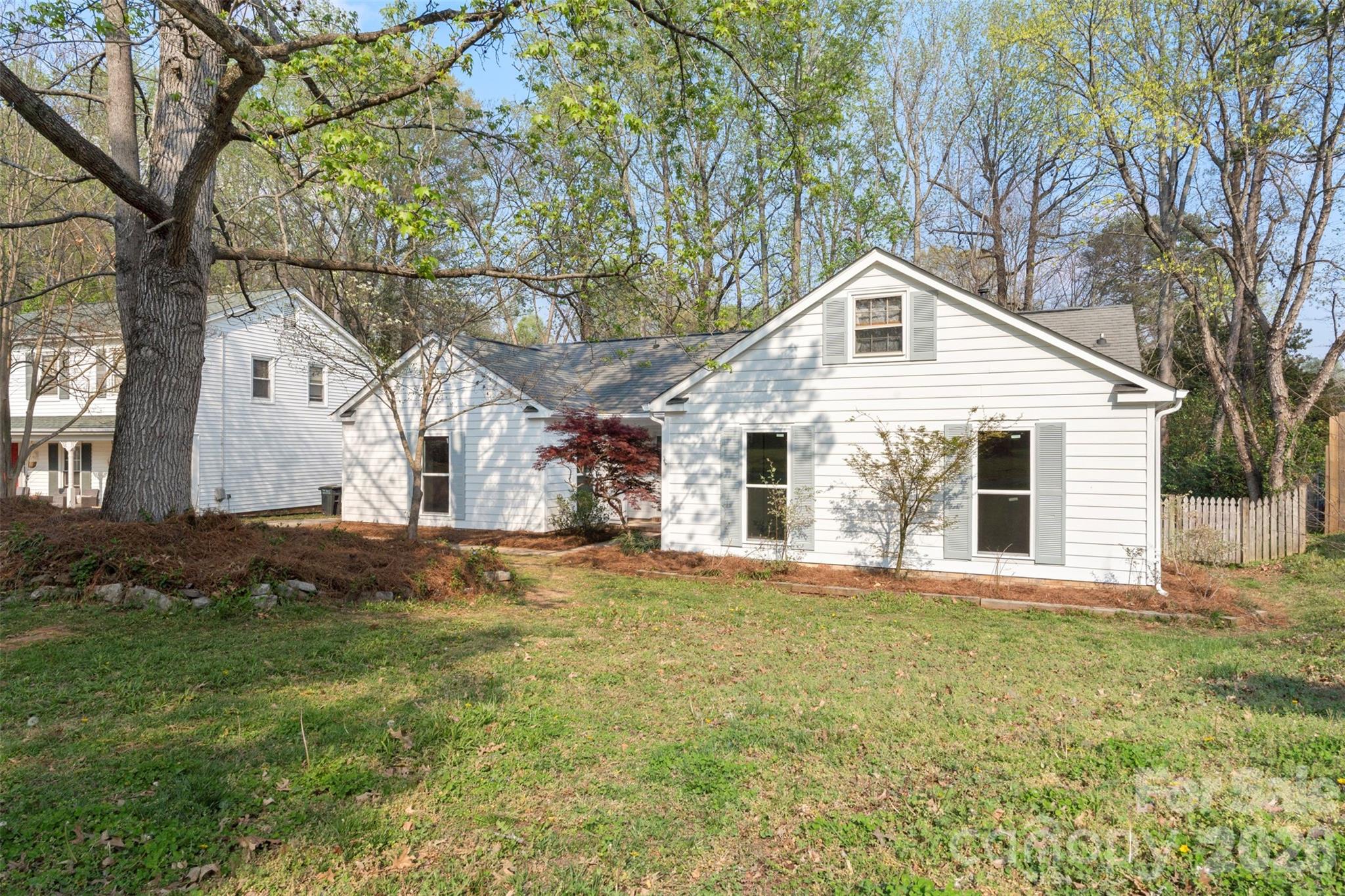 7308 Walterboro Road Charlotte, NC 28227 - Photo 3 of 43 a front view of a house with a yard