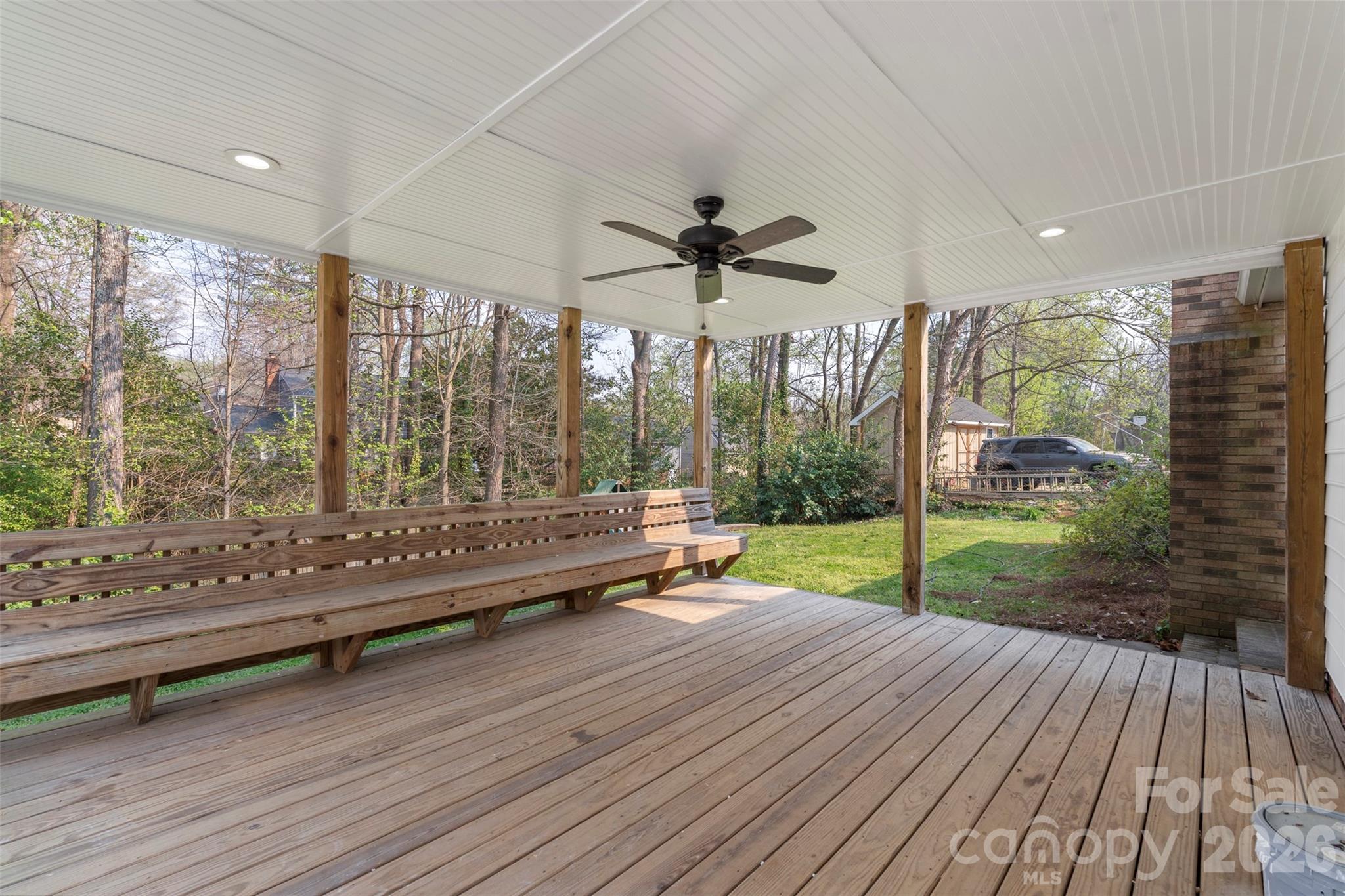 7308 Walterboro Road Charlotte, NC 28227 - Photo 32 of 43 a living room filled with lots of furniture and a wooden floor
