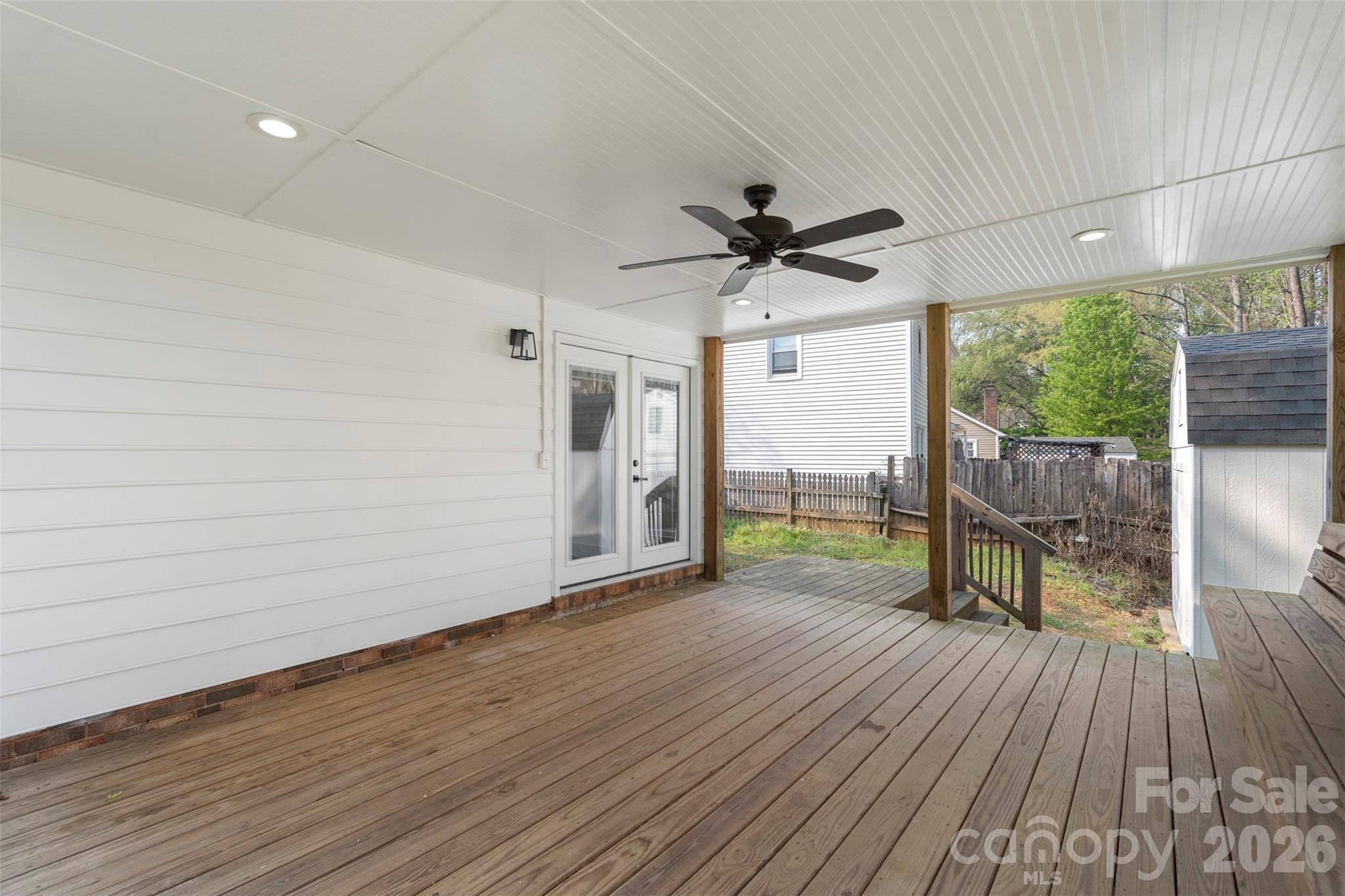 7308 Walterboro Road Charlotte, NC 28227 - Photo 33 of 43 a view of room with window wooden floor and a ceiling fan
