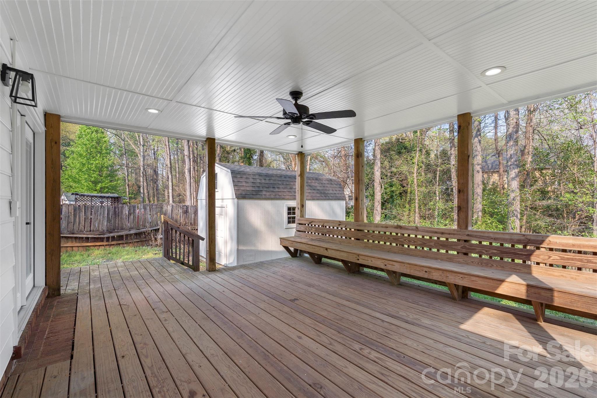 7308 Walterboro Road Charlotte, NC 28227 - Photo 34 of 43 a view of a room with furniture wooden floor and a ceiling fan