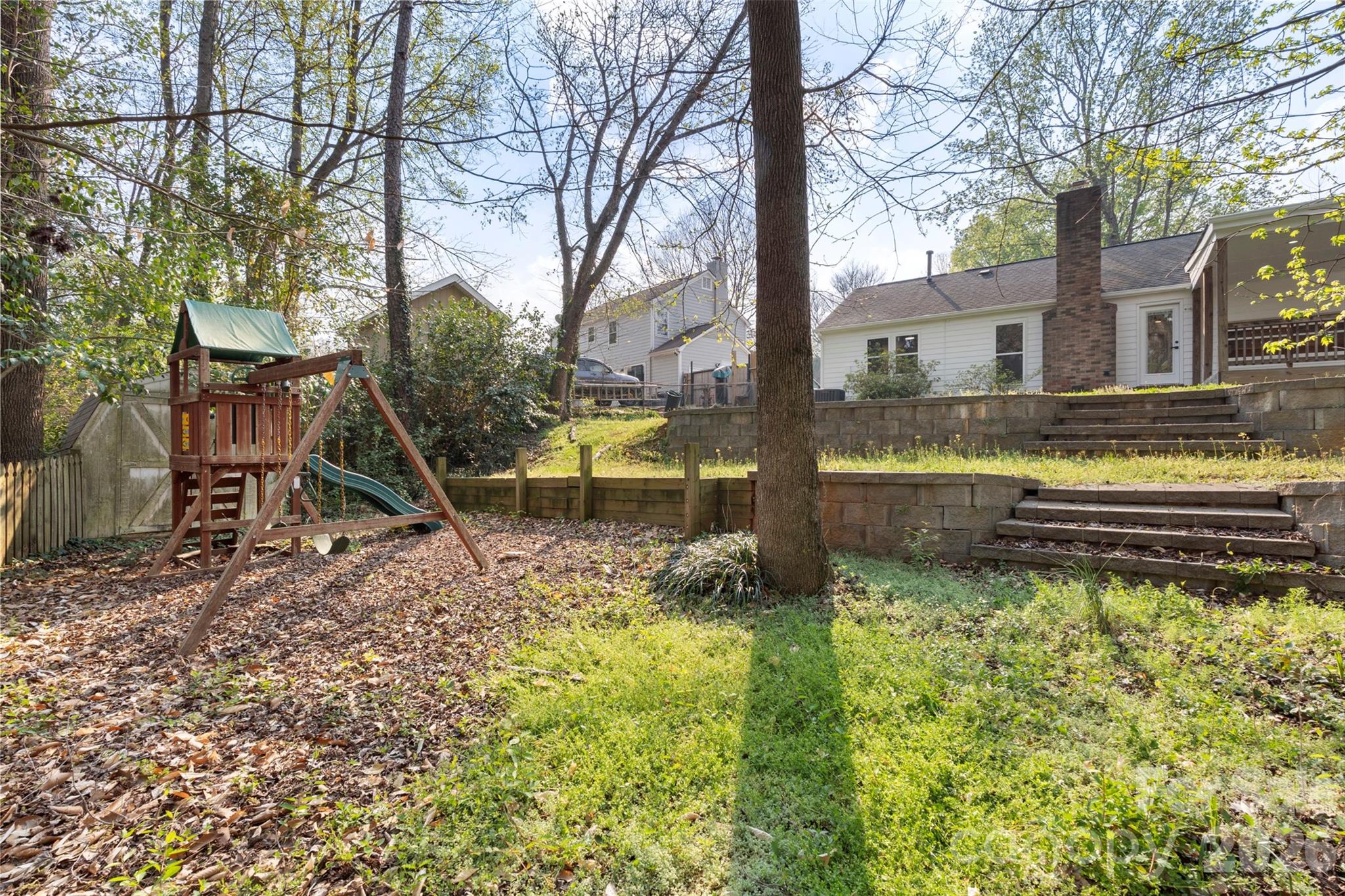 7308 Walterboro Road Charlotte, NC 28227 - Photo 38 of 43 a view of a house with backyard and sitting area