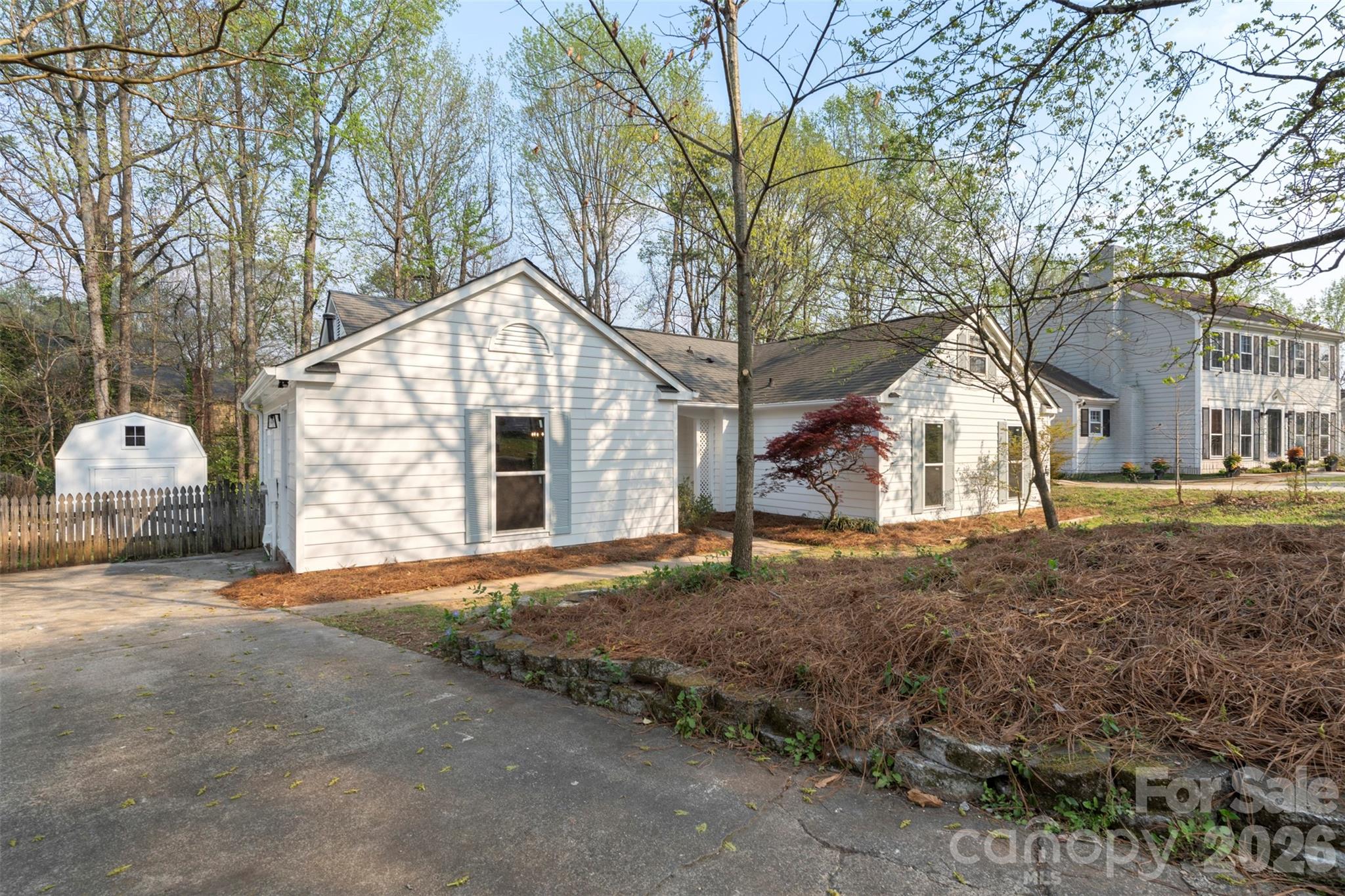 7308 Walterboro Road Charlotte, NC 28227 - Photo 4 of 43 a front view of a house with a yard and garage