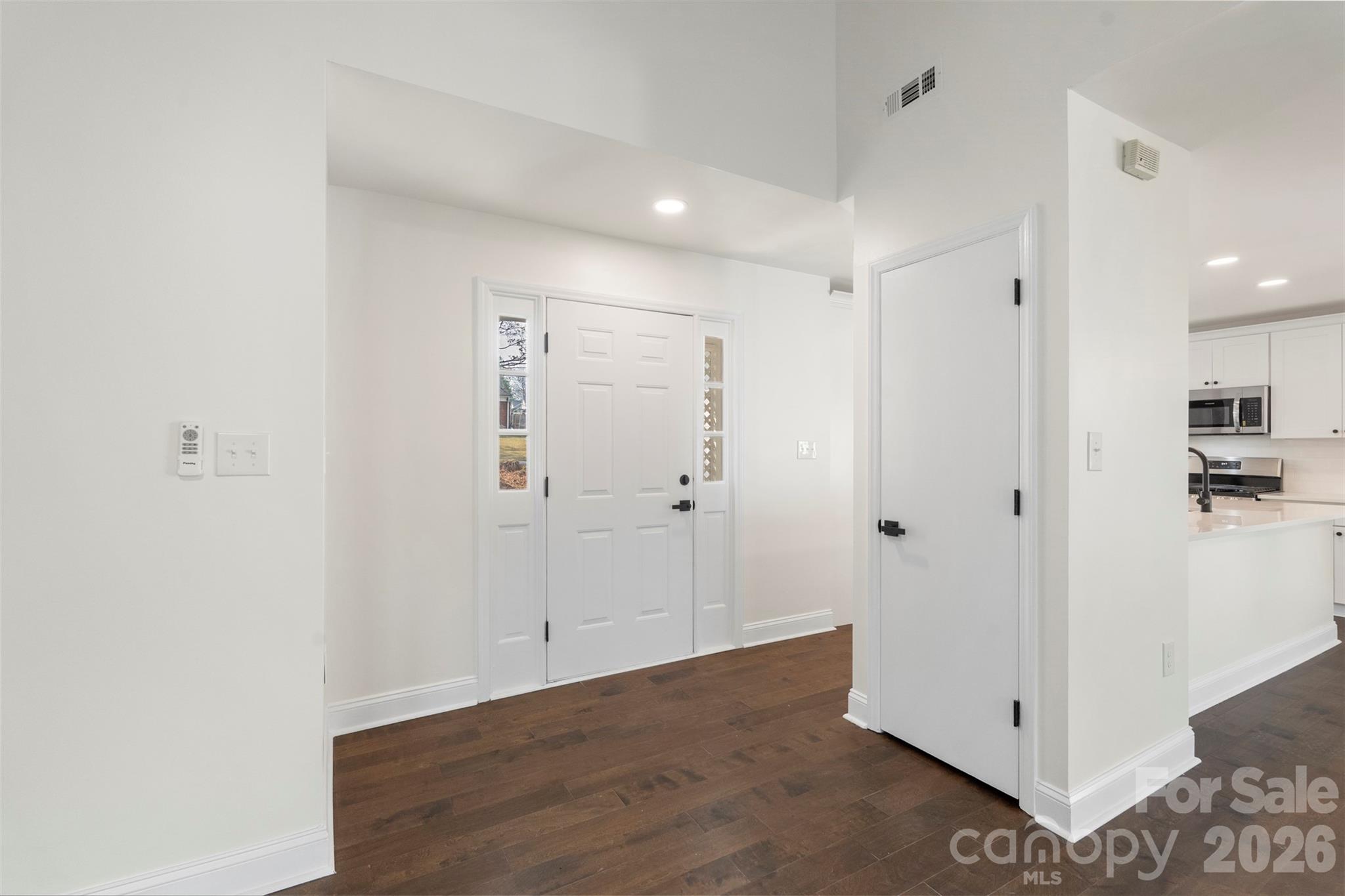 7308 Walterboro Road Charlotte, NC 28227 - Photo 8 of 43 a view of a hallway with wooden floor