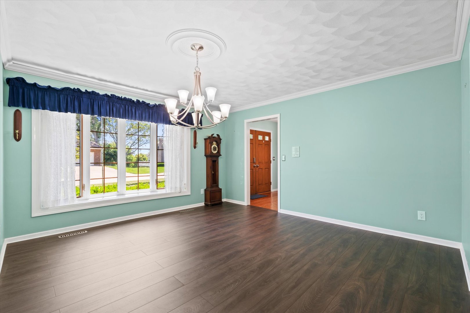 10 Oak Grove Road Geneseo, IL 61254 - Photo 5 of 43 a view of an empty room with wooden floor and a window