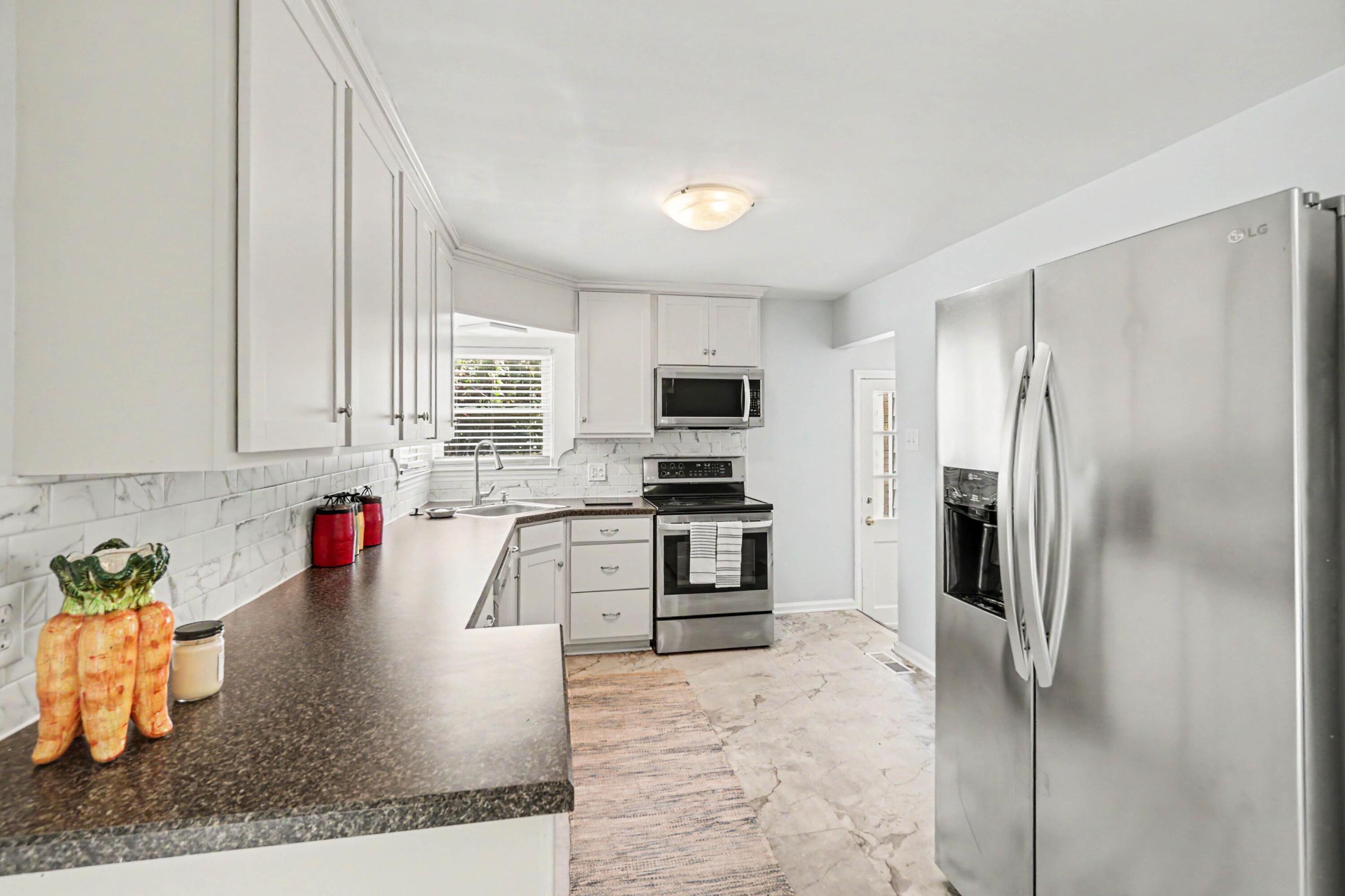 483 Springhill Drive Lexington, KY 40503 - Photo 8 of 30 Enjoy a functional kitchen layout with stainless steel appliances.
