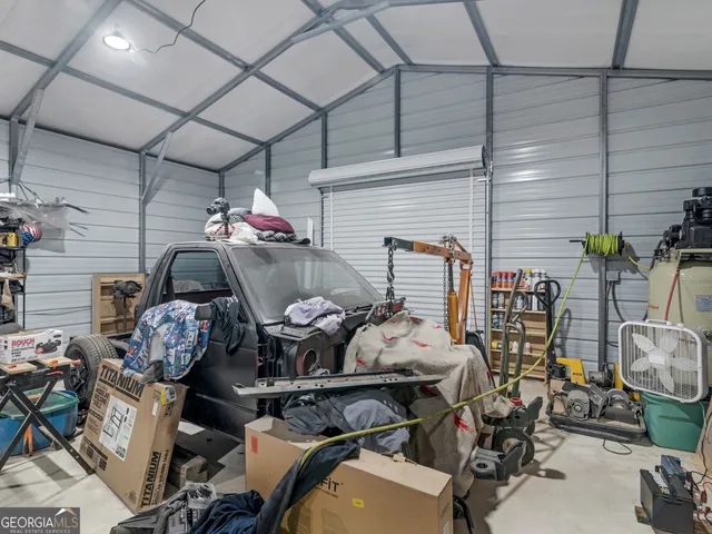 a roof deck with table and chairs