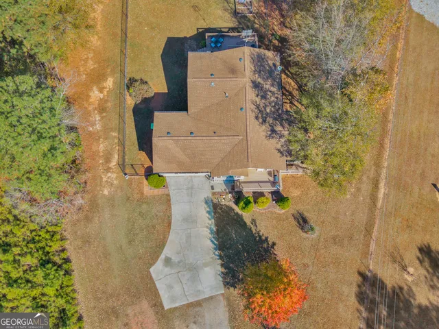 an aerial view of a house with swimming pool