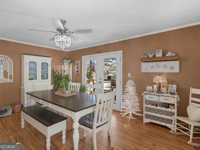 a view of a dining room with furniture and wooden floor