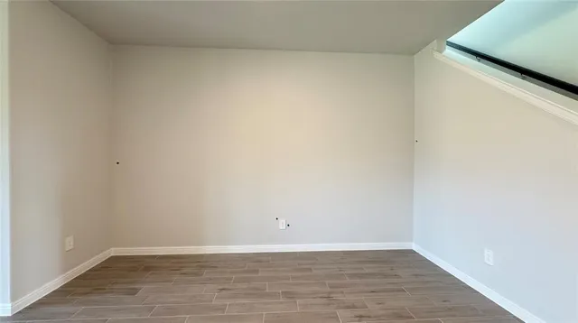 a kitchen with granite countertop kitchen island a sink a stove and cabinets