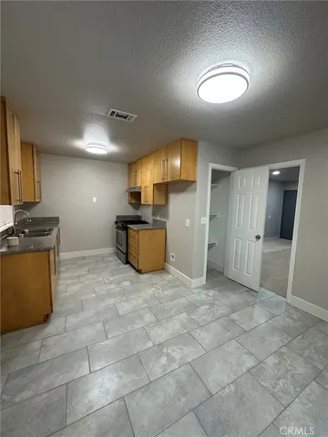 a view of a electric appliances in kitchen and empty room