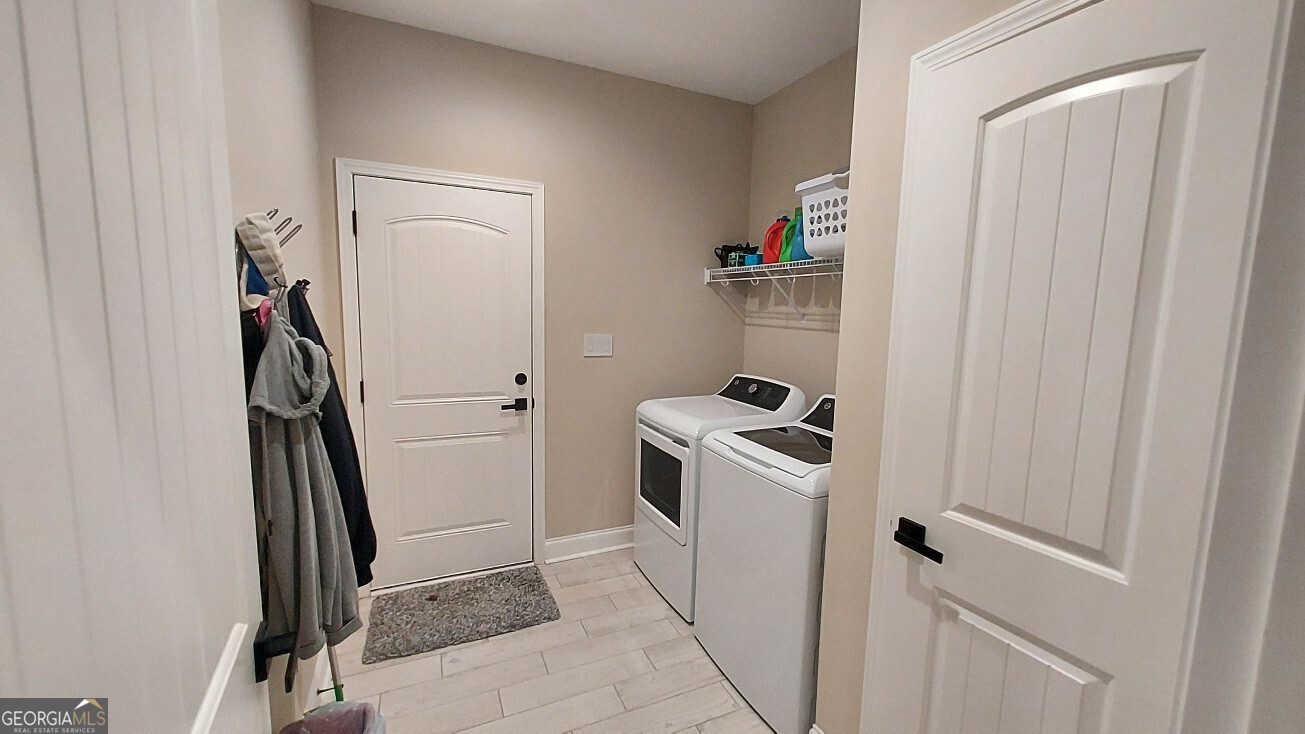 107 Lighterknot Trail Perry, GA 31069 - Photo 18 of 22 a view of storage and utility room with washer and dryer