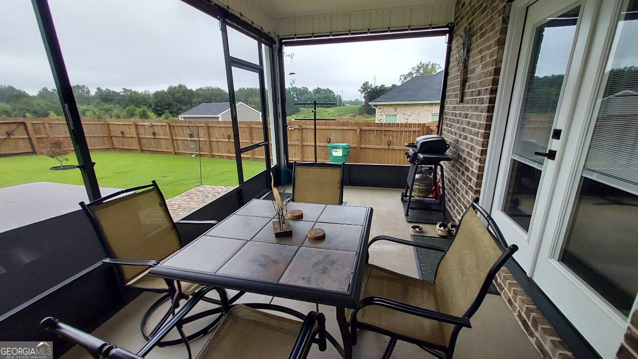 107 Lighterknot Trail Perry, GA 31069 - Photo 20 of 22 a view of an outdoor space with furniture and hardwood floor