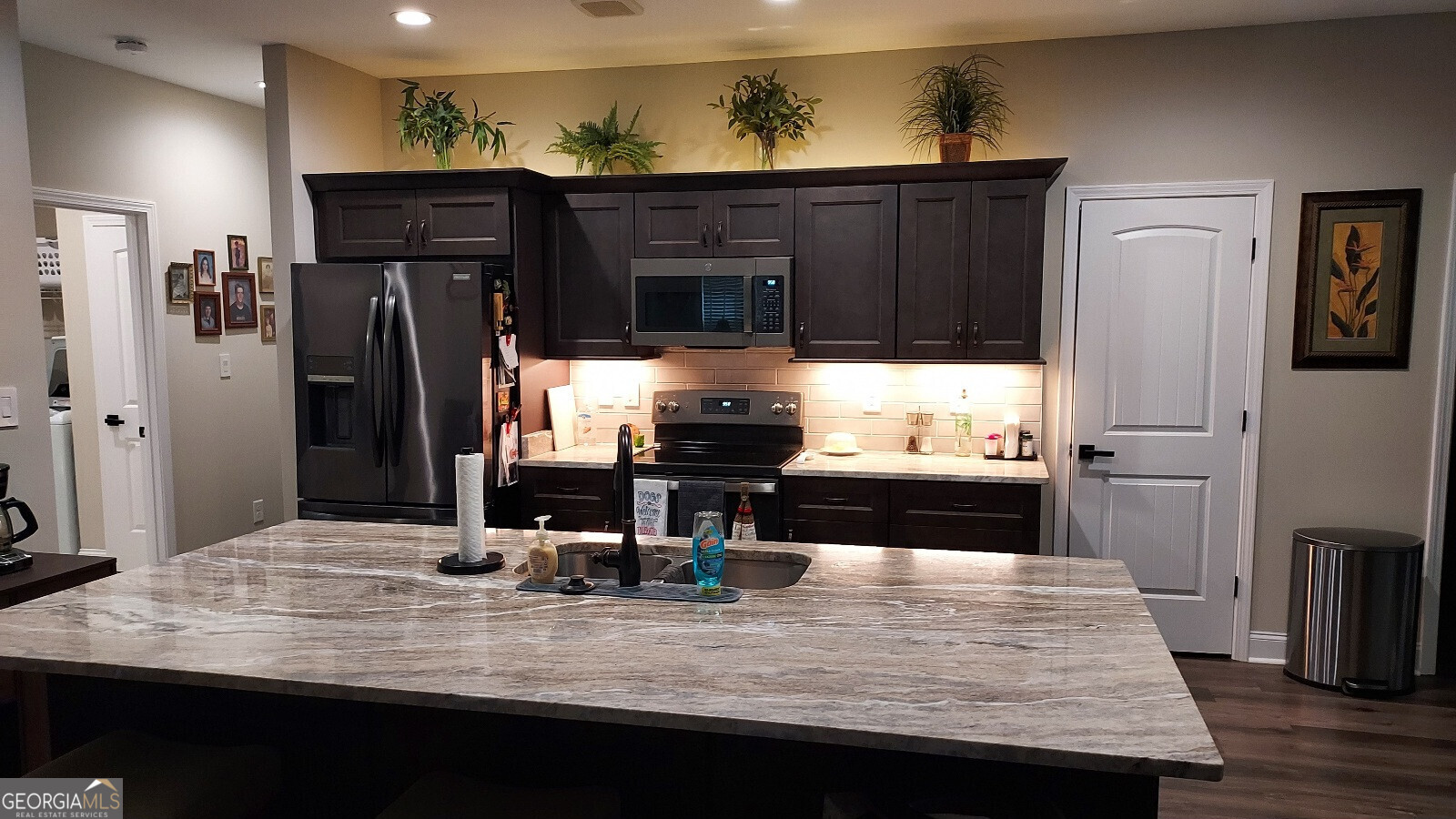 107 Lighterknot Trail Perry, GA 31069 - Photo 6 of 22 a kitchen with sink and refrigerator