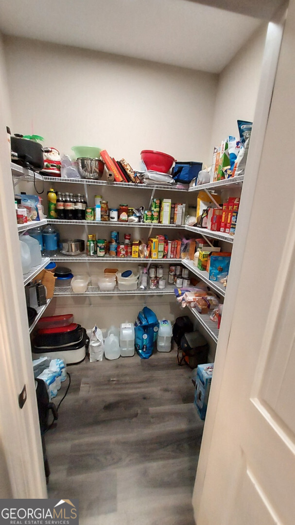 107 Lighterknot Trail Perry, GA 31069 - Photo 8 of 22 a room with lots of books and more things on it