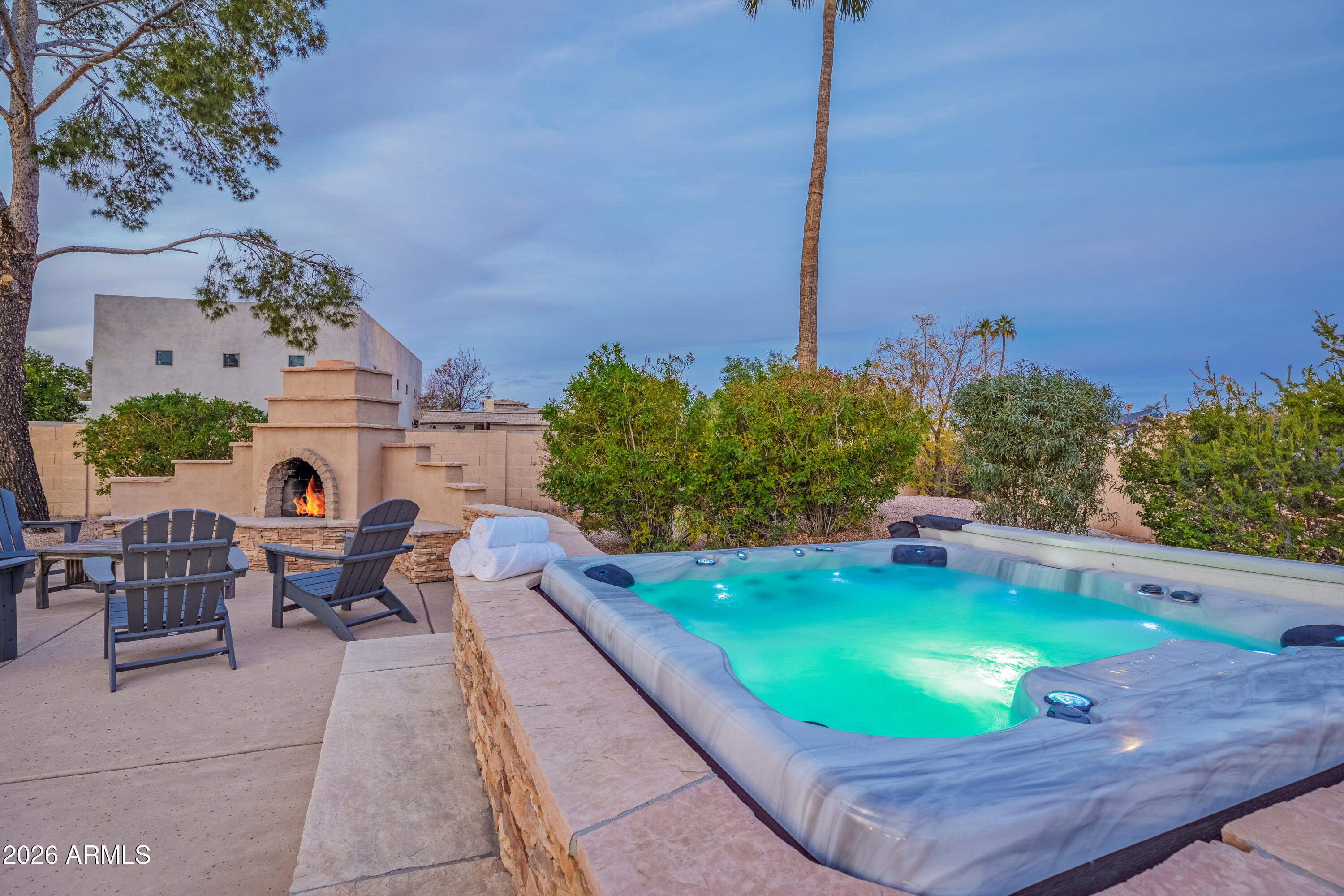 6932 East Presidio Road Scottsdale, AZ 85254 - Photo 3 of 30 a view of a swimming pool with chairs