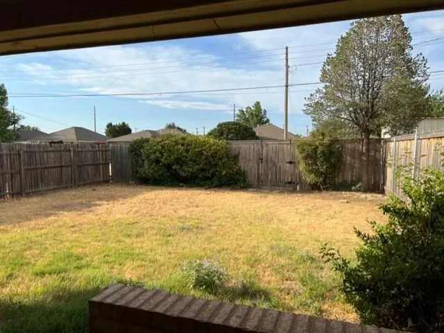 a view of small yard and mountain view