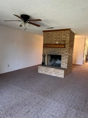 a living room with a fireplace