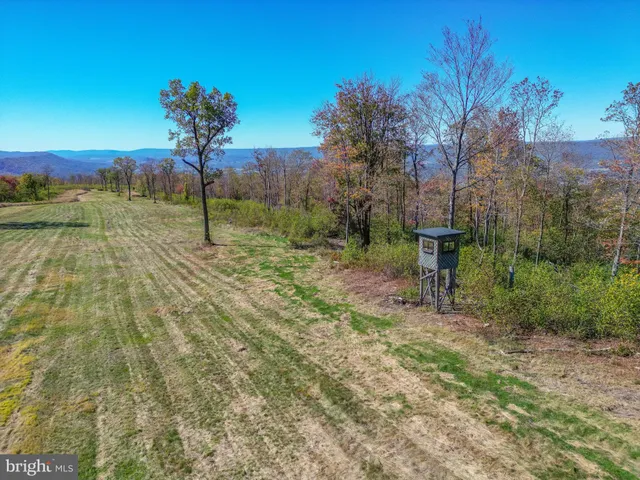 a view of a field with an outdoor space