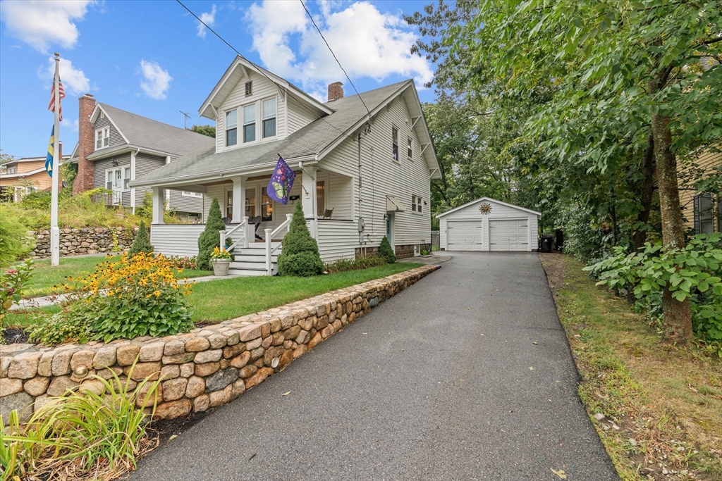 a front view of a house with garden