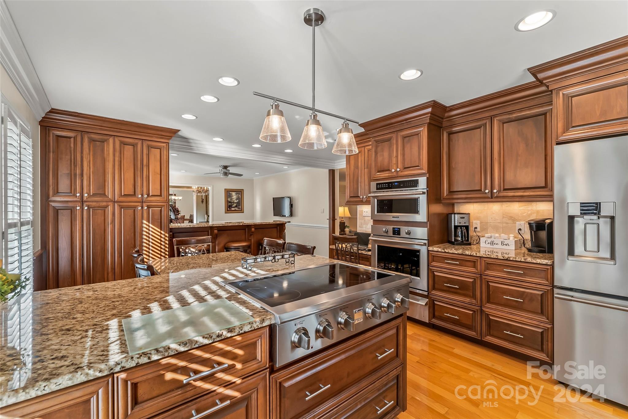 203 Lost Corner Road Morganton, NC 28655 - Photo 11 of 47 a kitchen with stainless steel appliances granite countertop a stove refrigerator and cabinets