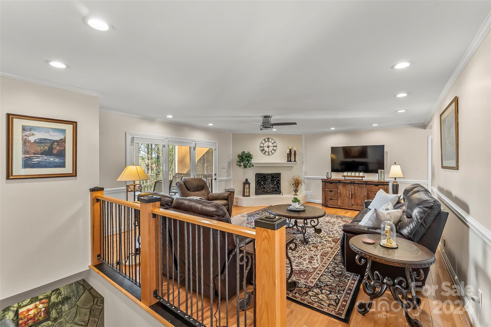 203 Lost Corner Road Morganton, NC 28655 - Photo 16 of 47 a living room with furniture a flat screen tv and a table