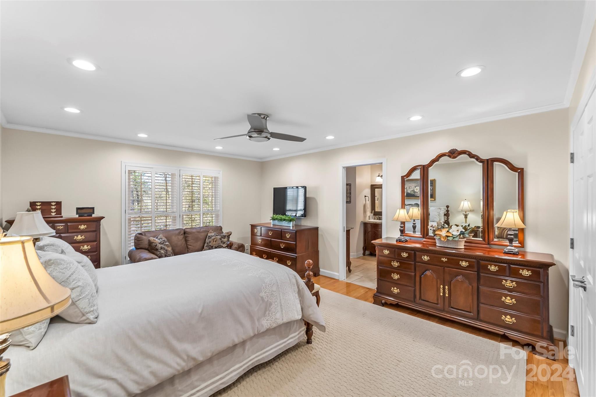 203 Lost Corner Road Morganton, NC 28655 - Photo 19 of 47 a bed room with a bed and a large mirror