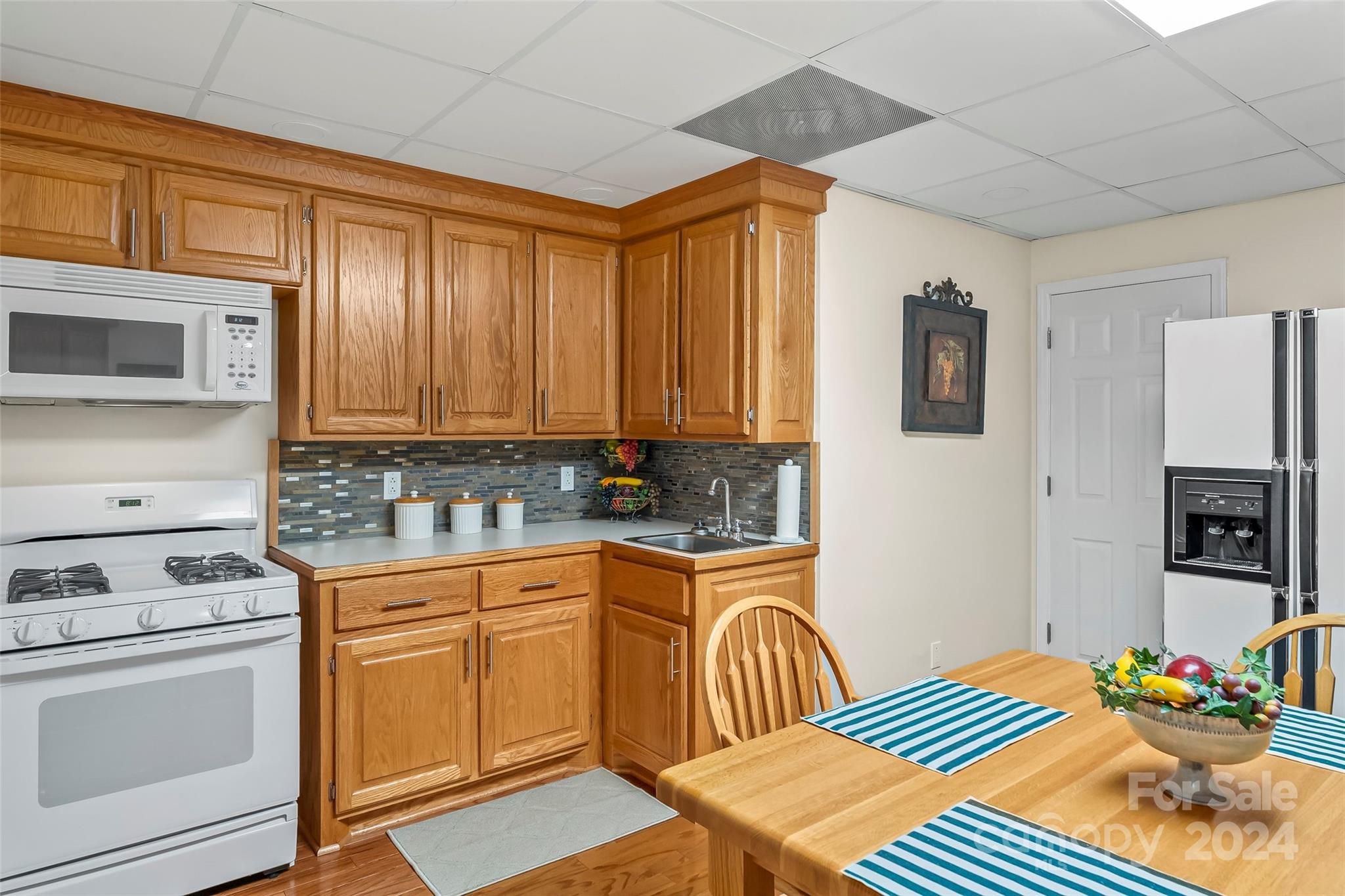 203 Lost Corner Road Morganton, NC 28655 - Photo 30 of 47 a kitchen with a stove a sink and a microwave